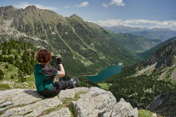 istock Senior hiking in the high mountains 2164570815