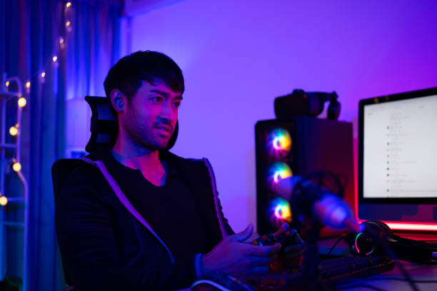istock Handsome man is livestreaming video game as influencer. 2164575960