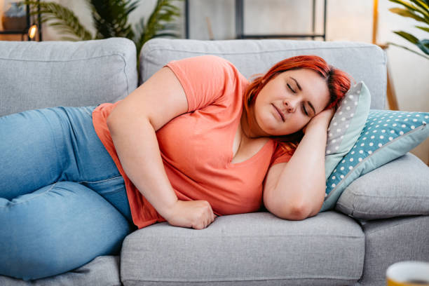 istock Young Woman Sleeping On The Sofa At Home 2164580096