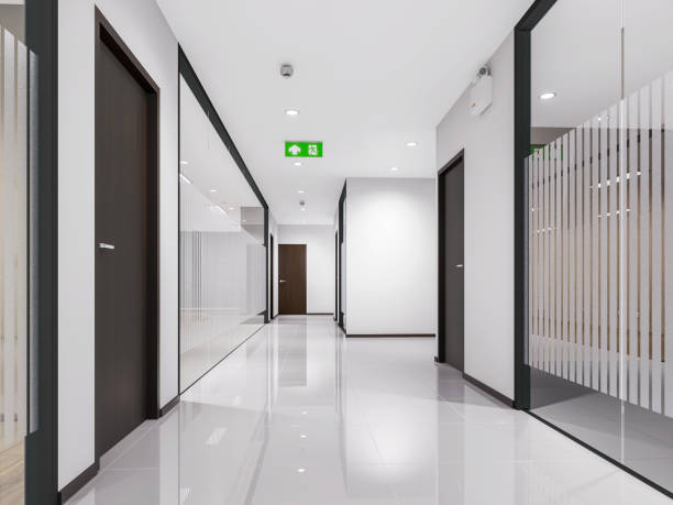 Empty office corridor with glass walls