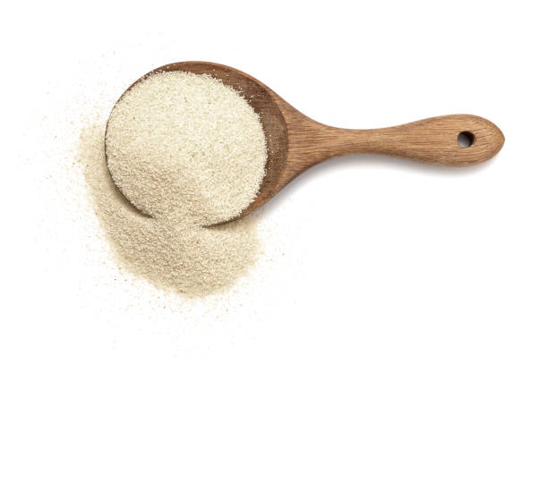 istock Semolina flour in wooden spoon 2164586381