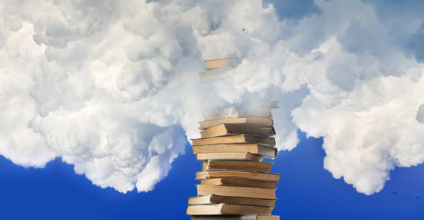 istock A Towering Stack Of Books Reaching Up Through The Clouds On A Sunny Day 2164587188