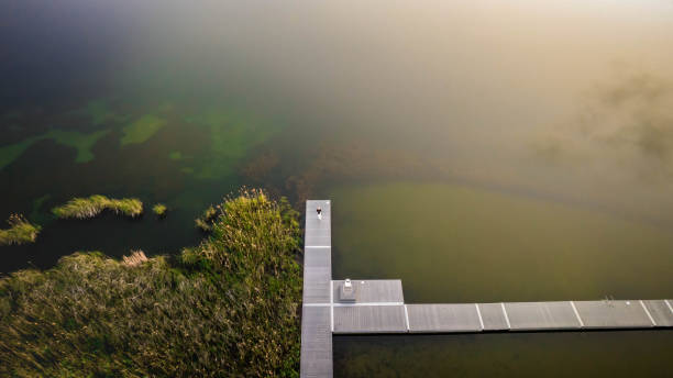 istock drone aerial view over the lake with sunset in the background 2164587632