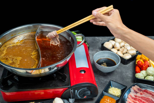istock A hand holding chopsticks with a piece of meat on it 2164587647