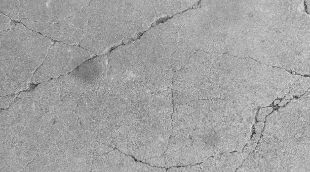 istock Cracked concrete wall texture, Cement background not painted in vintage style 2164588624