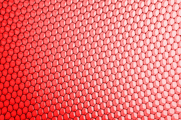 abstract texture honeycomb. Metallic net background or texture. metal mesh. full frame colourful illuminated detail of a metallic grid in front of a loudspeaker. Colorful abstract background.