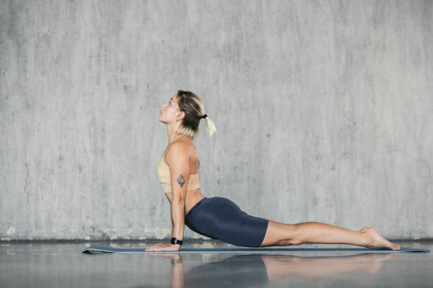 istock Practicing yoga exercise. Stretching and relaxation to improve strength and tone. Healing fitness for joint flexibility. Healthy lifestyle and wellbeing background 2164590925