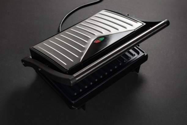 istock Modern electric grill on dark background 2164591254
