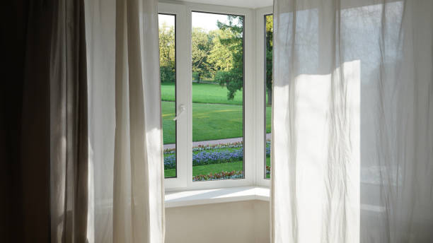 istock View from the window, green trees, landscape with flower. 2164594722