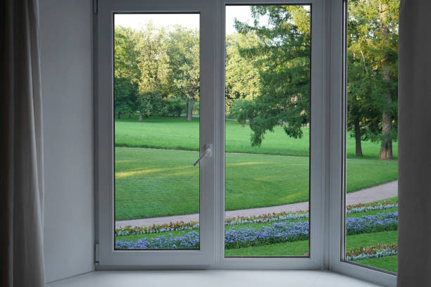 istock View from the window, green trees, landscape with flower. 2164594726