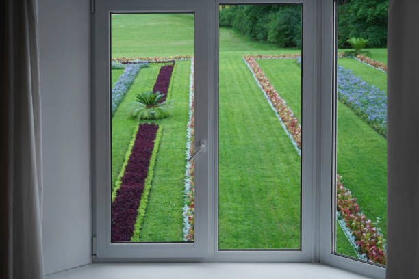 istock View from the window, green trees, landscape with flower. 2164594727