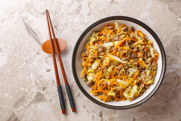istock Egg roll bowl it is a meal combines ground pork, shredded cabbage, and our favorite eggroll closeup. Horizontal top view 2164594735