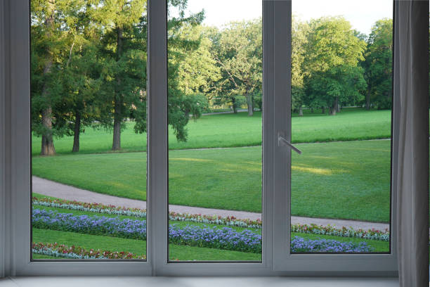 istock View from the window, green trees, landscape with flower. 2164594736