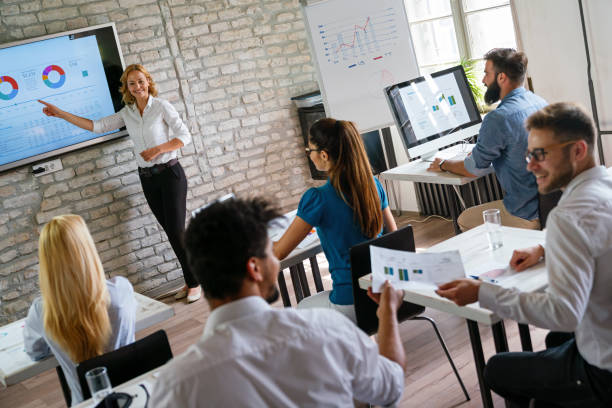 istock Group of multinational business people develop themselves in business training, meeting in office 2164595980