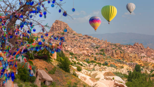 istock Nazars (evil eye) hanging on a tree in Pigeon Valley with Uchisar castle - Cappadocia Turkey 2164598068