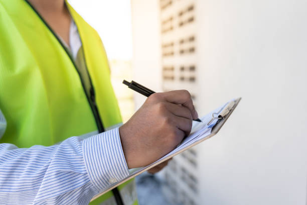 istock inspector or engineer is inspecting construction and quality assurance new house using a checklist. Engineers or architects or contactor work to build the house before handing it over to the homeowner 2164605371