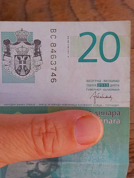 istock 20 serbian dinar in hand 2164607152