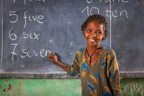 istock African little girl is learning English language 2164609065