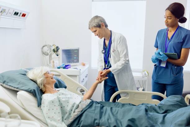 istock Doctor comforting her senior patient 2164609971