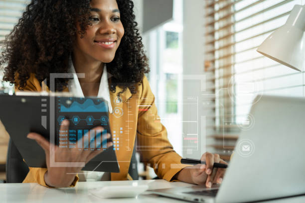 istock Business woman hand Project manager working and update tasks and Gantt chart scheduling virtual diagram.with smart phone, tablet and laptop in office. 2164610153
