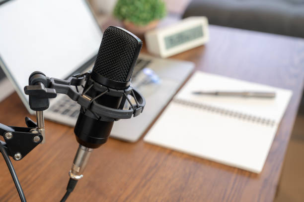 istock Concept of podcast, broadcasting or recording home studio with microphone and notebook or laptop. 2164617621