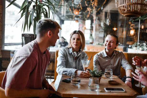 istock Fun Times For Smiling Friends Drinking Afternoon Coffee in Bar 2164617763