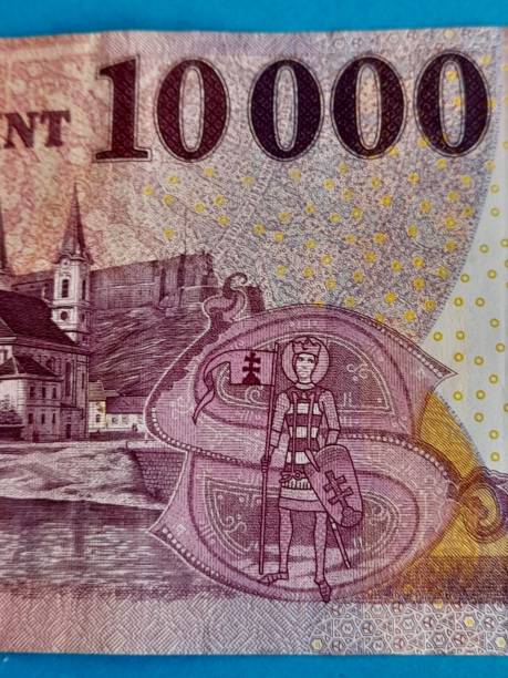 istock 10000 hungarian forint banknote with blue background 2164621166