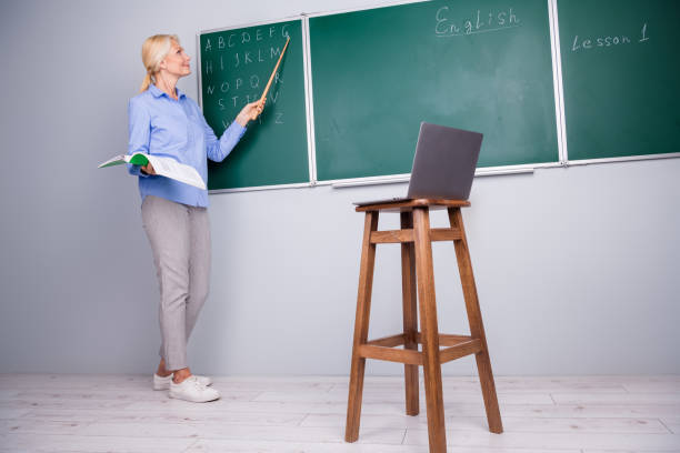 Photo of charming adorable qualified woman school college teacher work with pupils remotely explain material Photo of charming adorable qualified woman school college teacher work with pupils remotely explain material. qualified report stock pictures, royalty-free photos & images