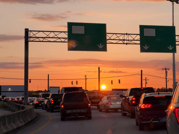 istock heavy traffic at sunrise 2164623112