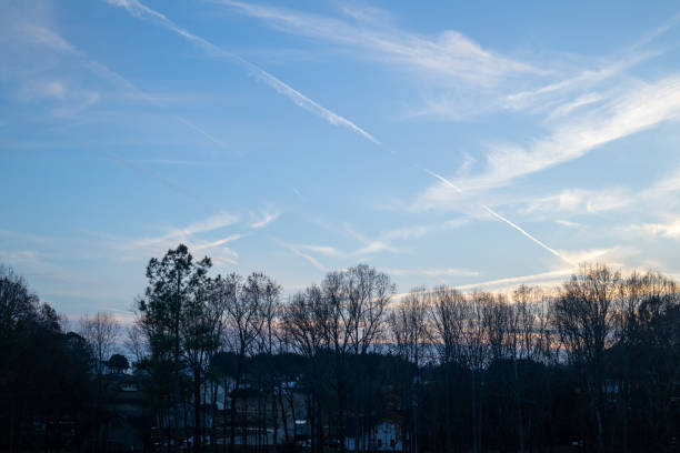 condensation trails over the mountains