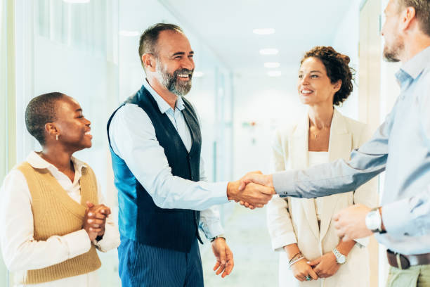 istock Business people shaking hands in the office 2164624690