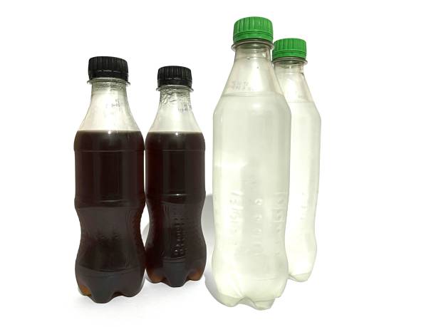 Glass of cola with ice cubes and straw isolated on white background