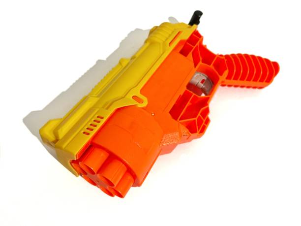 istock Children gun toy isolated on white background 2164625077