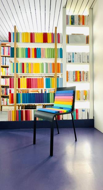 istock Rainbow chair in the library, pink floor 2164626745