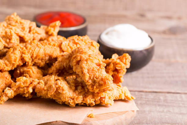 istock Crispy fried chicken breast strips with sauce 2164627760