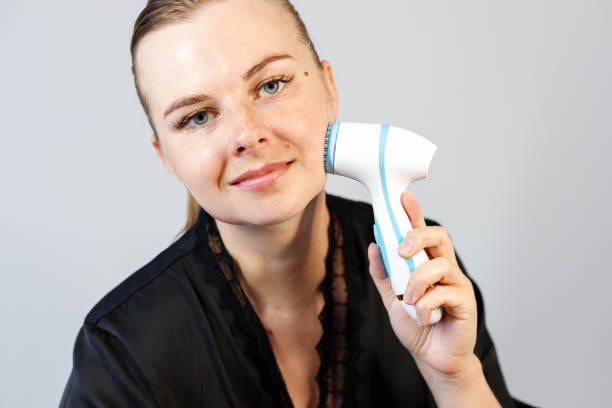 istock portrait woman 3-s doing massage for wrinkles 2164627862