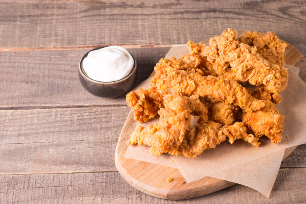 istock Crispy fried chicken breast strips with sauce 2164627974