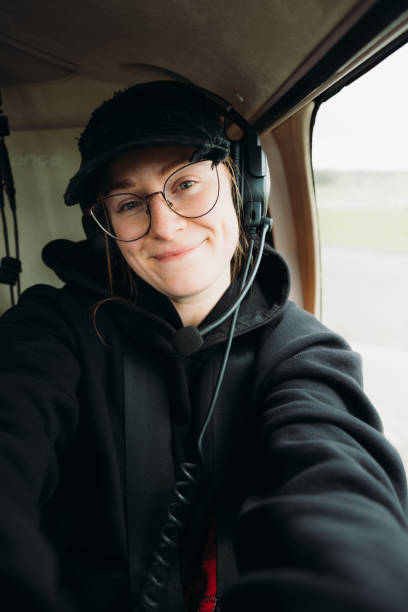 istock Cheerful Woman Making Selfie in Cockpit Flying in Small Airplane 2164630421