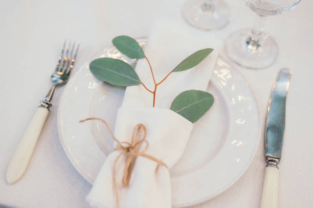 istock Table setting with napkin on empty white plate, wineglasses and cutlery on table, copy space. Place setting at wedding reception. Table served for banquet 2164630712