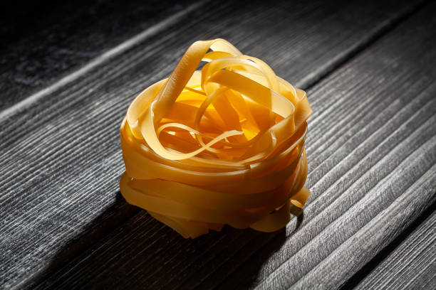 pasta tagliatelle on wood