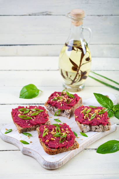 istock Toasts with beetroot, chopped nuts and herbs. Vegan bruschetta with beet 2164630989