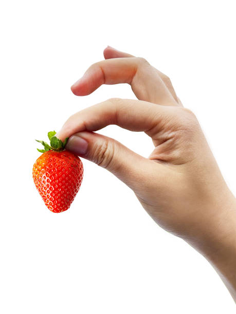 istock Woman hold fresh strawberry on a white background 2164638339