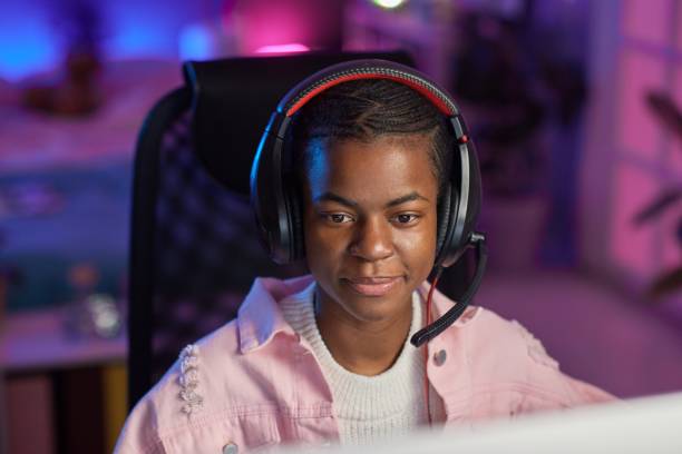 istock Girl Wearing Headset Gaming 2164640350