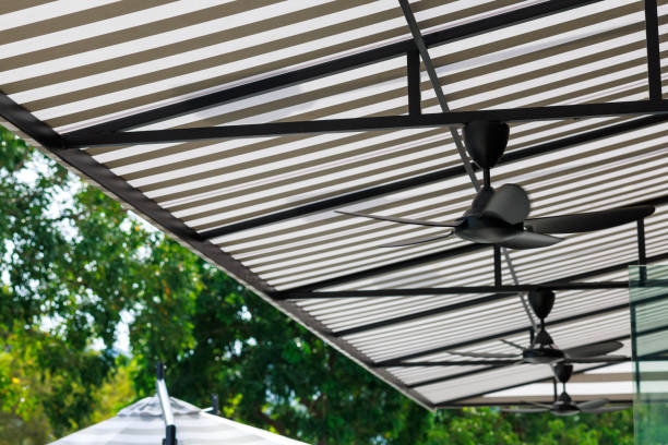 Low angle view black and white stripped awning at a outdoor cafe