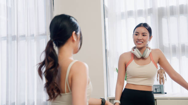 istock Young Asian women talking to each other before exercising in Pilates studio. 2164643541