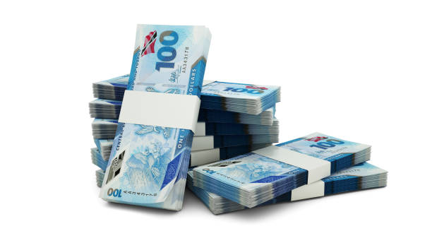 istock 3D rendering of Stack of Trinidad and Tobago dollar notes isolated on white background 2164645269