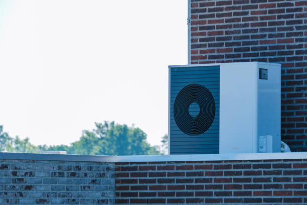 istock Air Source Heat Pump Installed on Rooftop in Bright Daylight 2164647582