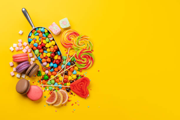 istock Various colorful candies, lollipops, and macaroons 2164651214