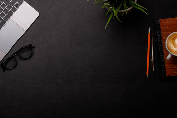 istock Workplace essentials: Laptop, coffee, notepad, supplies 2164652725