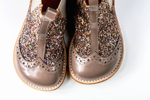 istock Little kids boots with glitter on white 2164653037